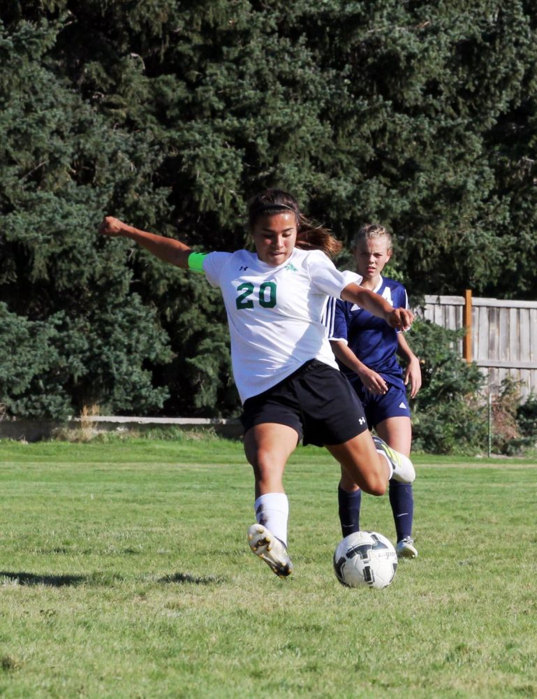 POWER. Sierra Sanchez stays ahead of pursuers while making an attack on the goal.