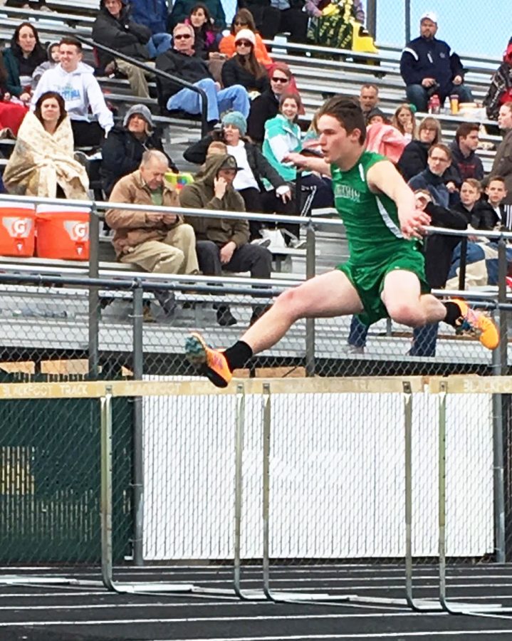 Crea Conquist (12) powers through the 110 meter hurdles, achieving a new personal record.