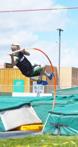 TOUCH THE SKY. Landon Abercrombie (12) shoots high in the sky in pole vault.