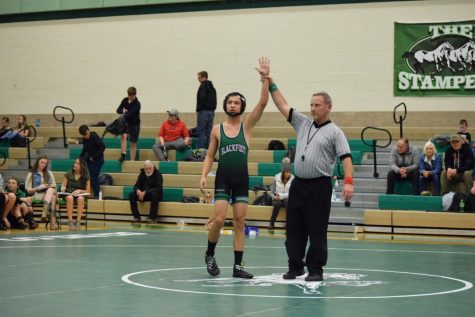 WINNER WINNER. The referee raises the arm of Avian Martinez (10) as he is announced winner by default.