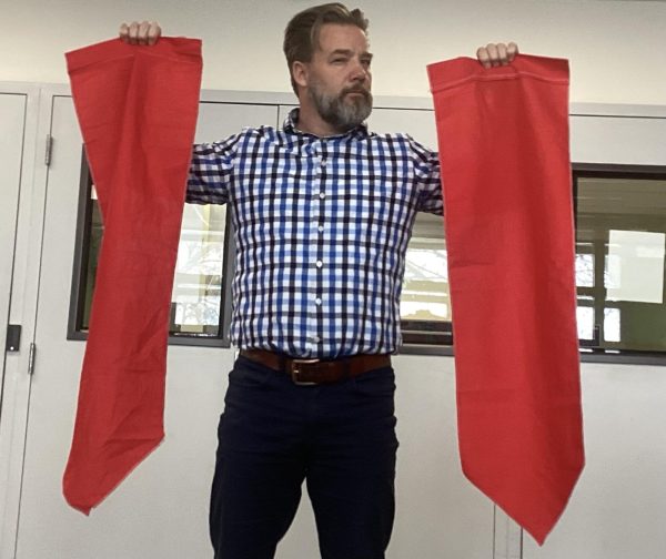 Mr. Joesph Abercrombie holding the red banners.